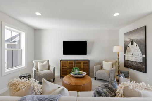 Bonus room features windows on both the front and back of home.