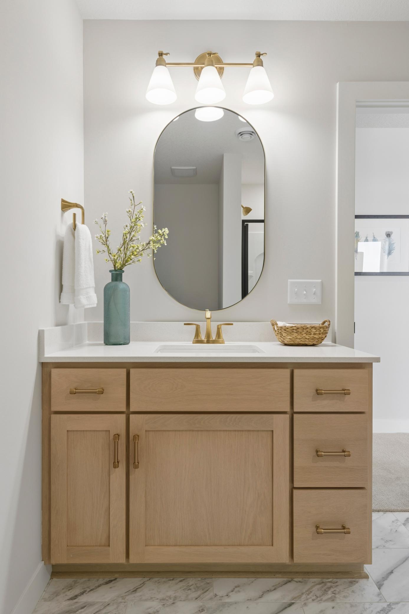 Custom cabinets and quartz countertops in lower level bath.