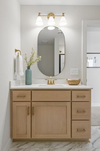Custom cabinets and quartz countertops in lower level bath.
