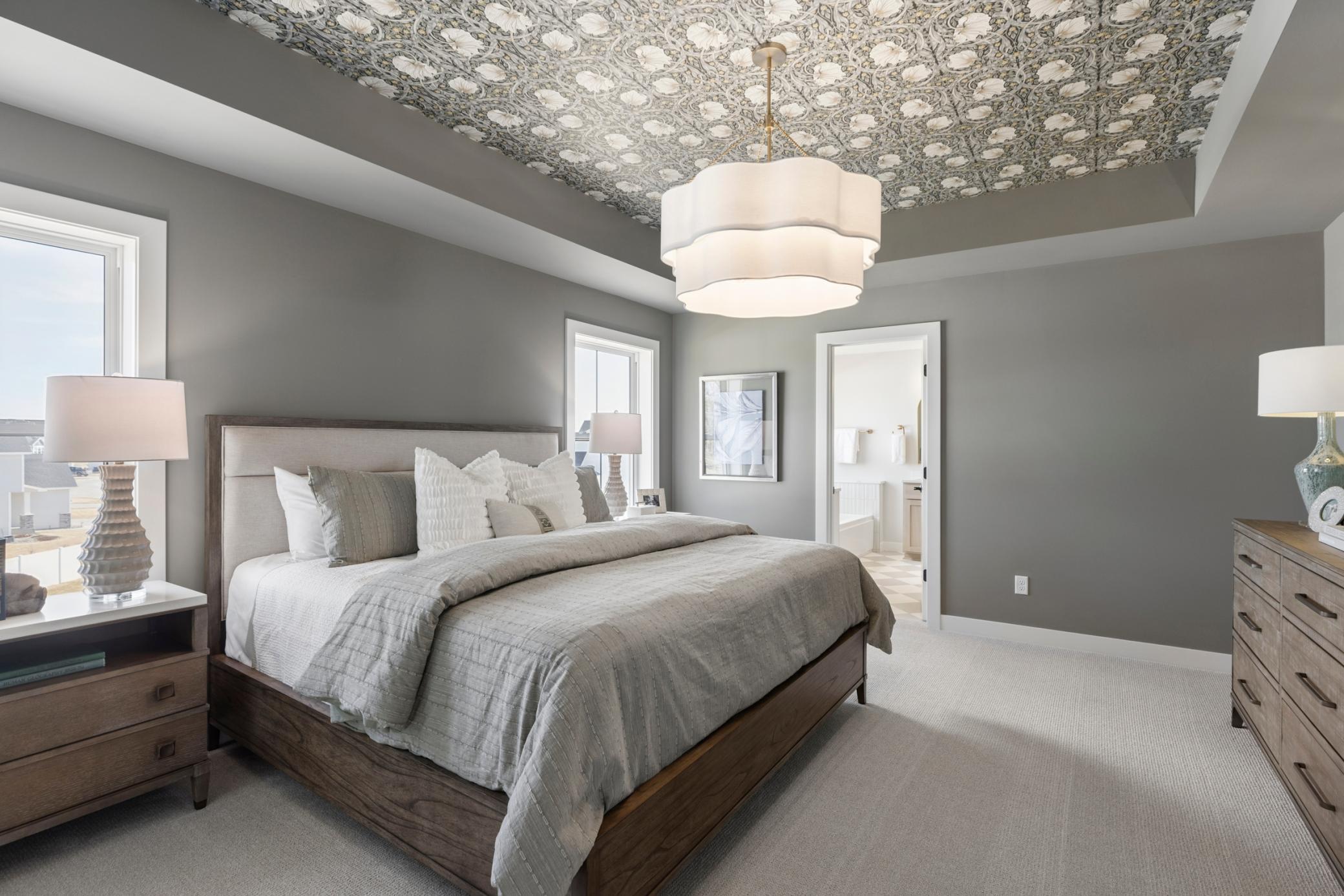 Spacious primary bedroom with private bath and large walk-in closet.