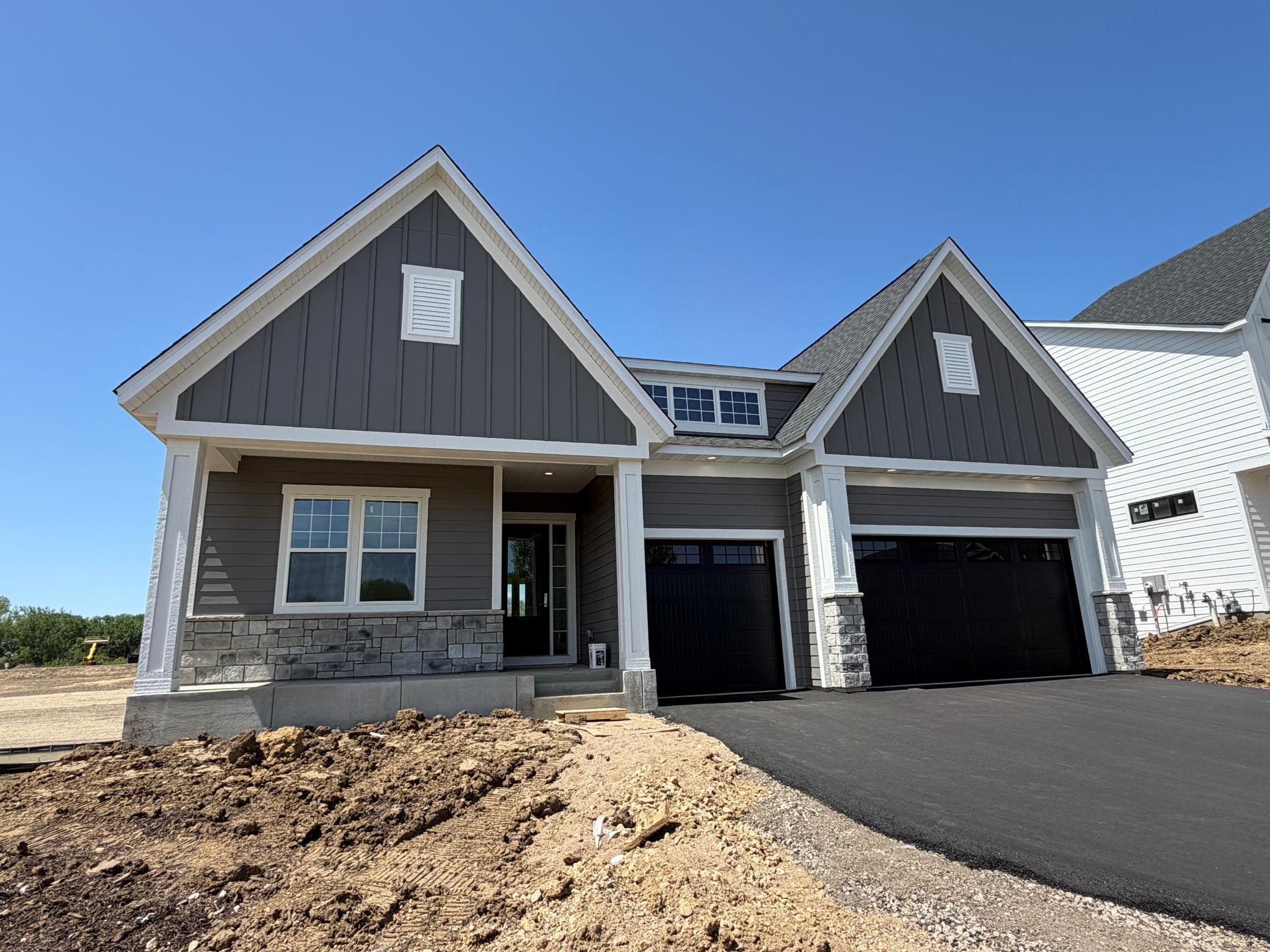 Enjoy effortless single-level living in this beautifully designed home featuring a welcoming front porch and a spacious, covered rear deck overlooking private water. Perfectly blending indoor comfort with outdoor relaxation!