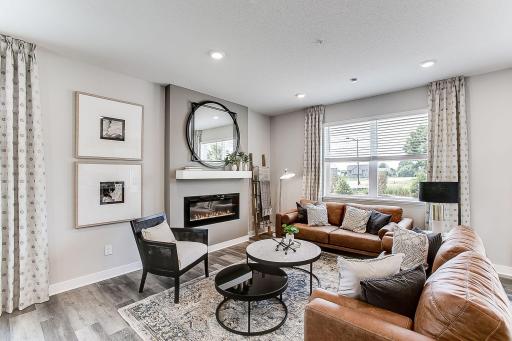 Cozy family room with lots of natural light pouring in! *Model home, colors and finishes will vary.