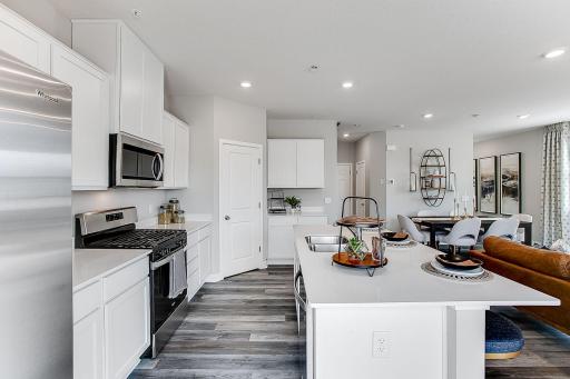 Large island makes prep work or entertaining a crowd easy! *Model home, colors and finishes will vary.