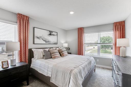 Relax after a long day in the spacious primary bedroom with private bathroom. *Model home, colors and finishes will vary.
