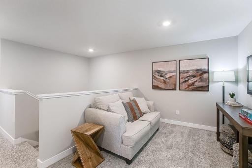 Upper level offers a charming loft - the ideal hang out spot. *Model home, colors and finishes will vary.