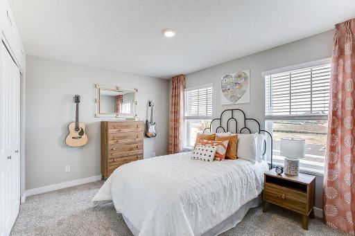 2nd of 4 large bedrooms, all on the upper level. *Model home, colors and finishes will vary.