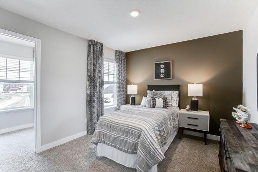 Another large bedroom, this one with a walk-in closet! *Model home, colors and finishes will vary.