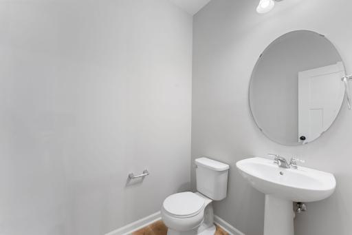 Convenient powder room on the main level. Similar home shown, options can vary.