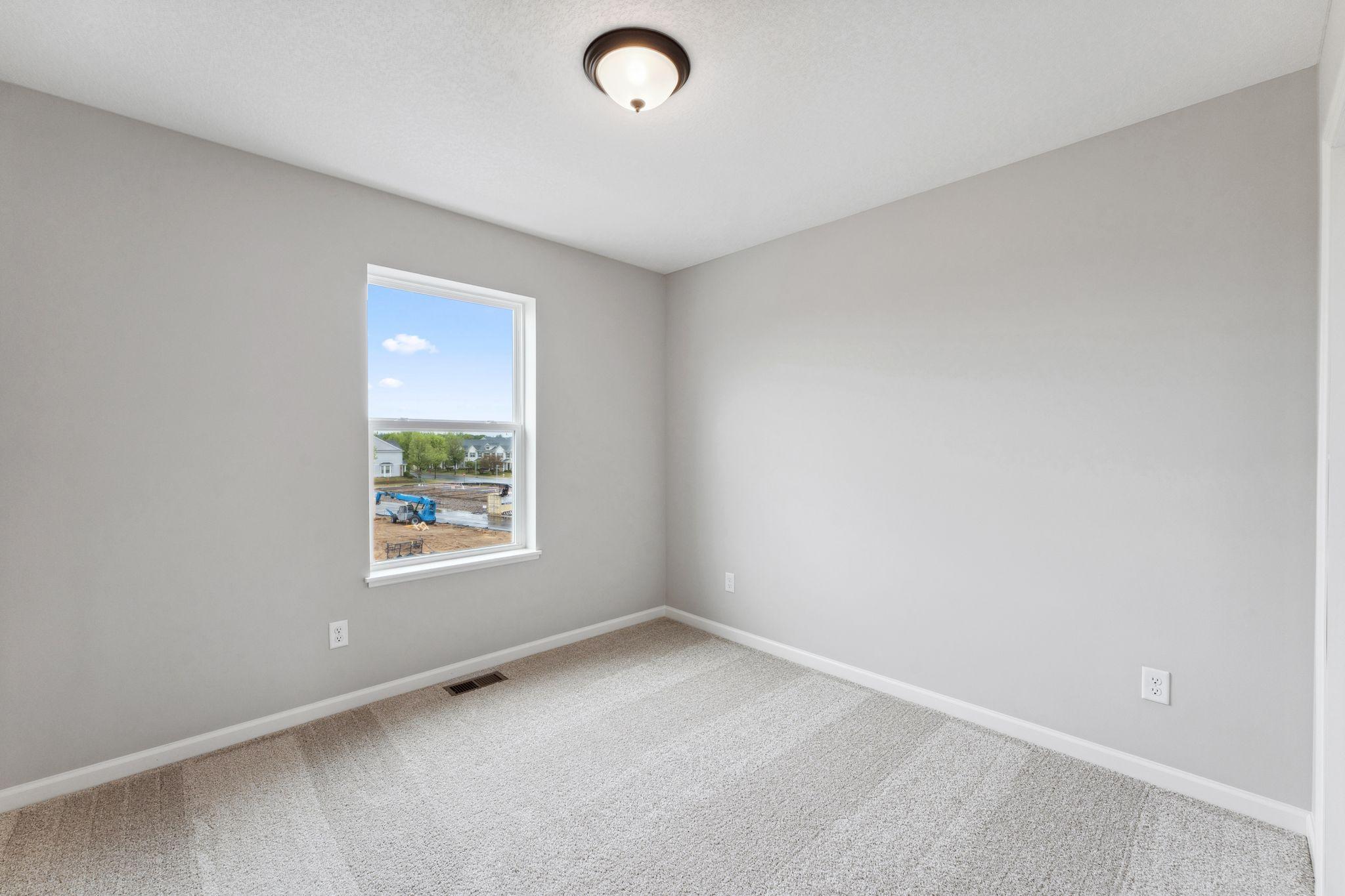 Secondary bedroom. Similar home shown.