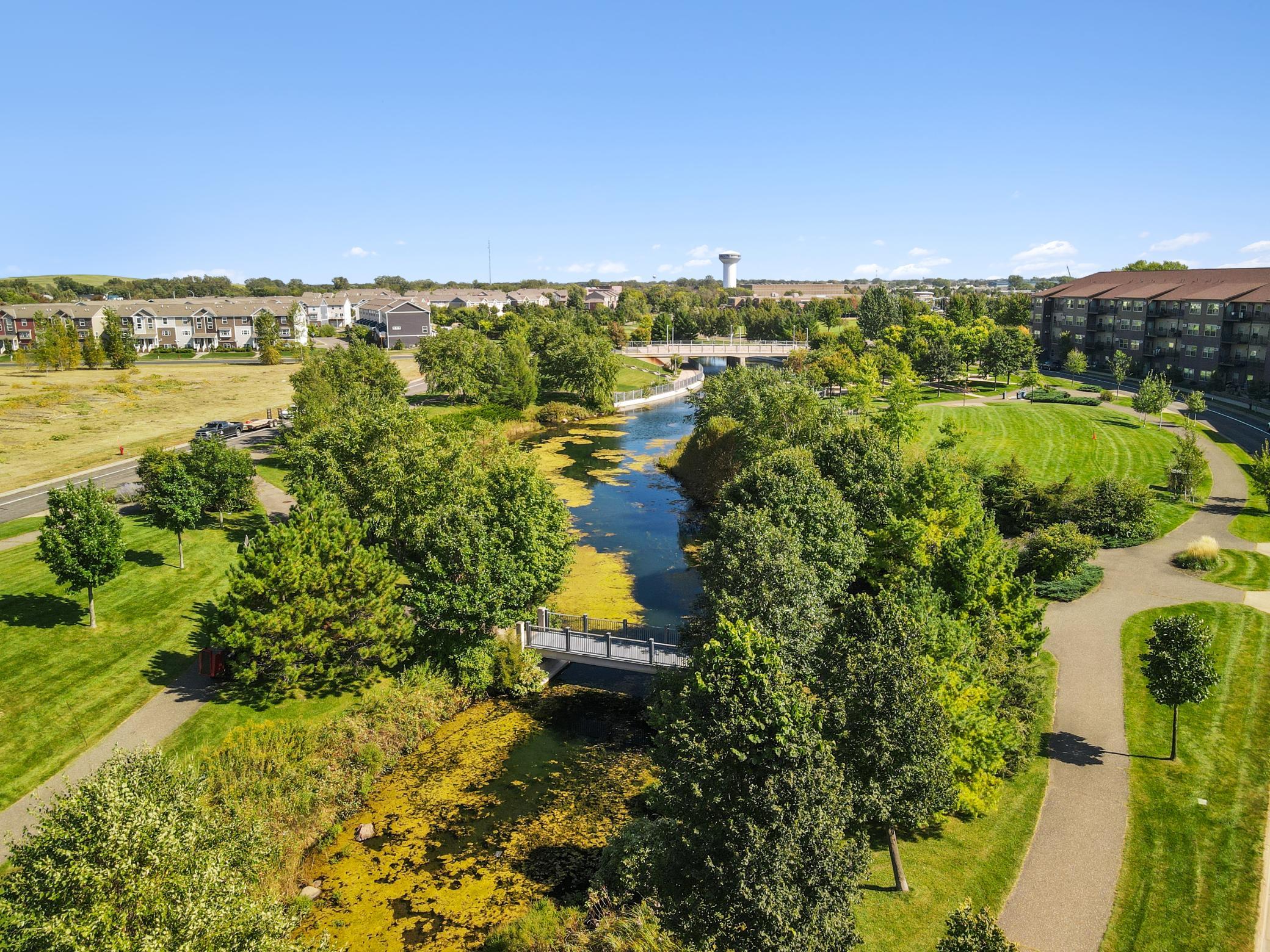 Enjoy lush tree lined views along the walking path.