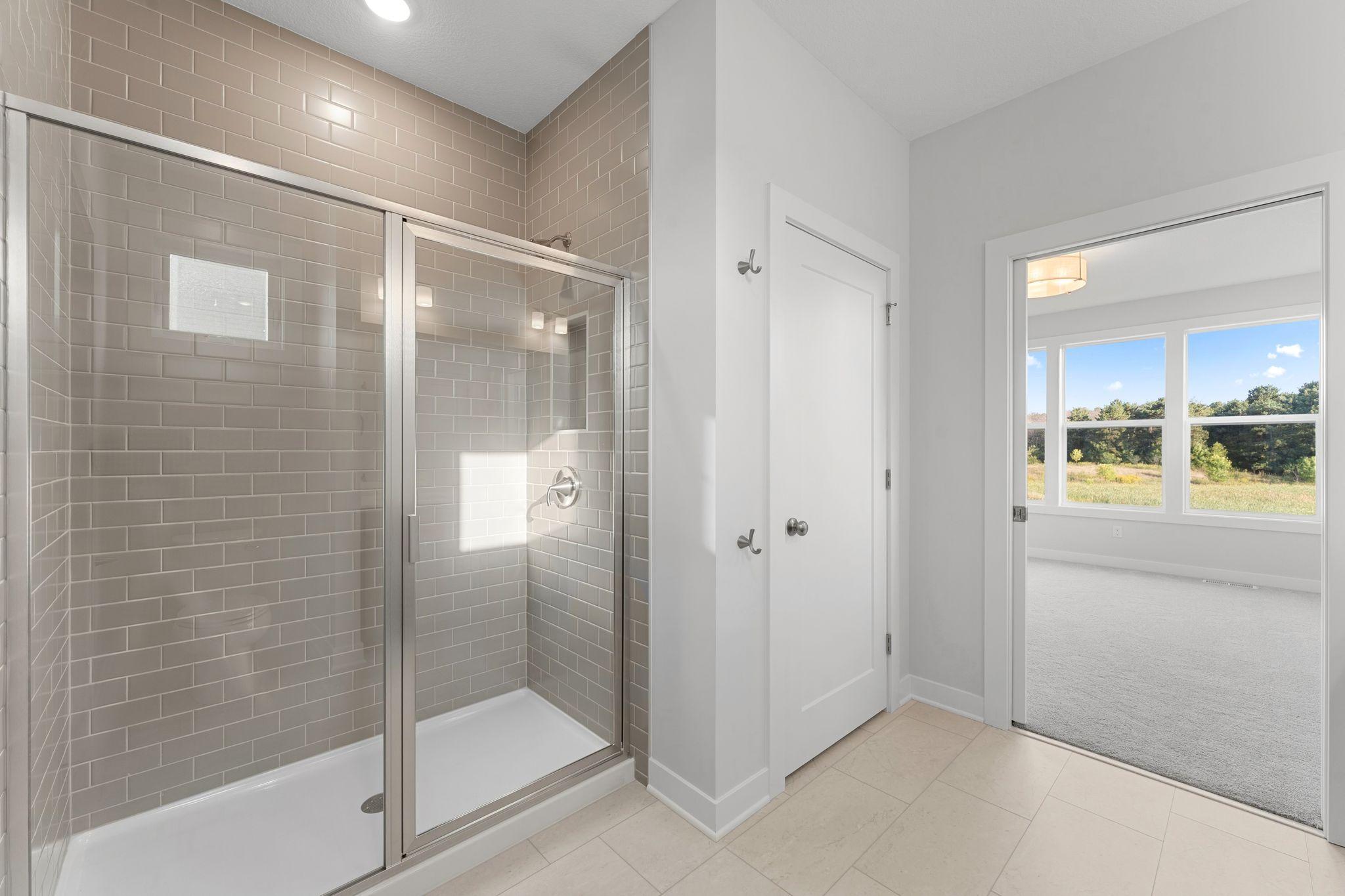 Tiled Shower and Linen Closet