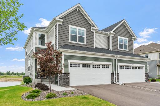 LIKE NEW twin home on premium lot w/ pond, wetland & nature views