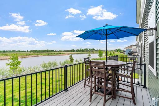 LIKE NEW twin home on premium lot w/ pond, wetland & nature views