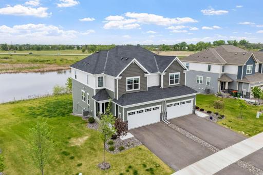LIKE NEW twin home on premium lot w/ pond, wetland & nature views
