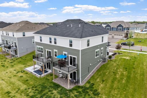 LIKE NEW twin home on premium lot w/ pond, wetland & nature views