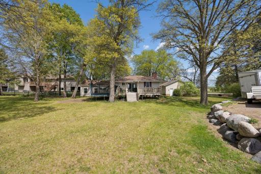 Back of the home offers lots of sunlight and a nice big deck and yard