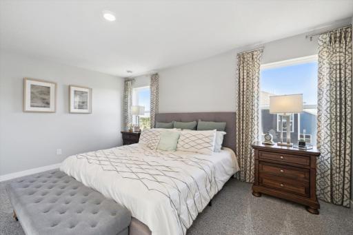 An oasis on it's own, the home's primary suite is awesome and loaded - including immediate access to a private bath that is equally appointed with features and is home to an oversized walk-in closet! Photo of model, colors & options will vary.