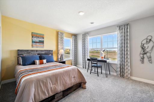 In addition to the primary bedroom, the home's upper level also includes these three additional bedrooms, and another full bathroom just adjacent to each! Photo of model, colors & options will vary.