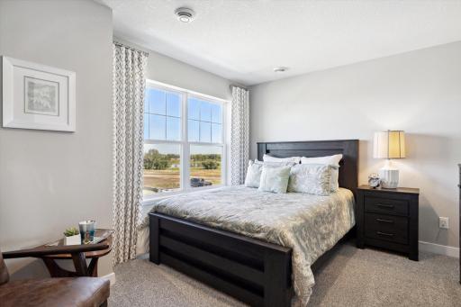 In addition to the primary bedroom, the home's upper level also includes these three additional bedrooms, and another full bathroom just adjacent to each! Photo of model, colors & options will vary.