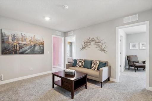 Once upstairs, the entire level flows from the focal point offered by this huge loft space. Sure to become a family favorite, the room is just steps from each of the home's Four upper level bedrooms! Photo of model, colors & options will vary.