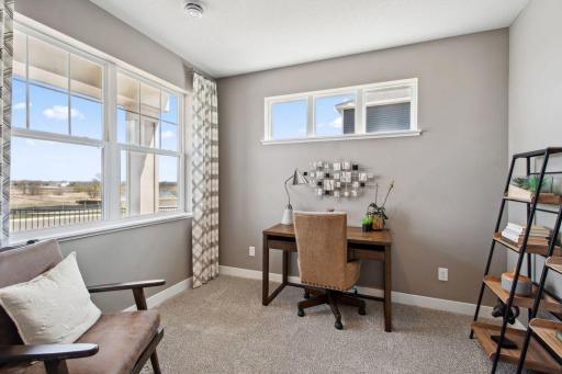Located in the front of the home - this main level flex room provides endless opportunities; including a home office, formal dining area, an extra playroom or another sitting room. Photo of model, colors & options will vary.