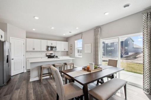 Conveniently located in the corner of the kitchen is a walk-in pantry, providing plenty of storage space! Photo of model, color and options will vary.