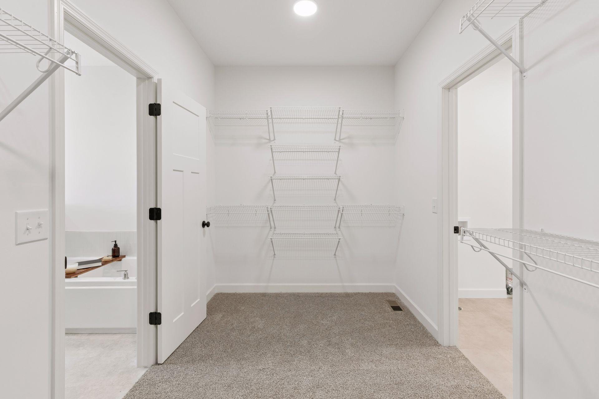 Primary Walk through Closet to Laundry Closet