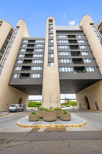 Drive-up entrance with convenient access, guest parking nearby, and a striking architectural presence.