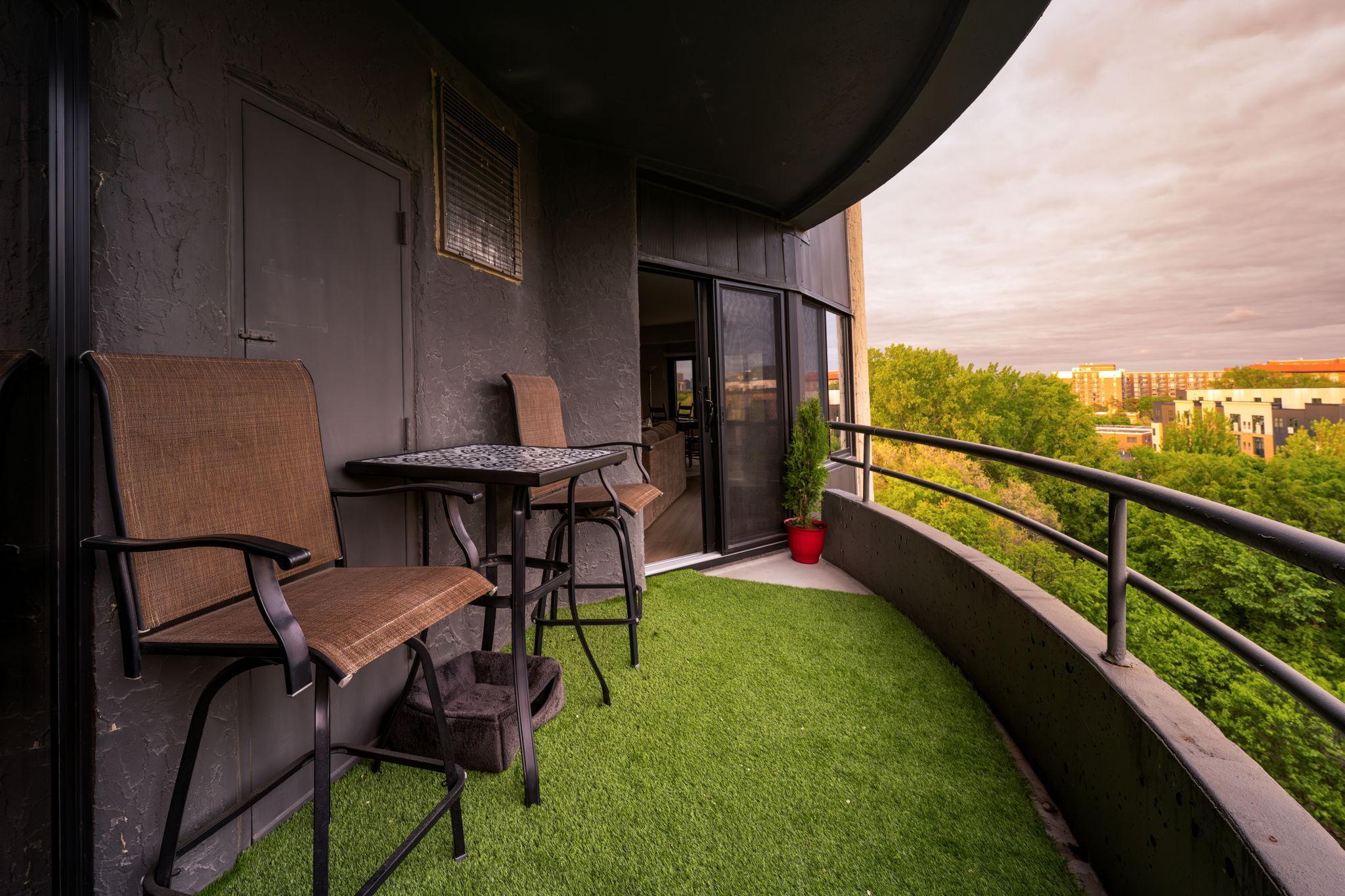 Spacious private balcony with room to relax or entertain while enjoying elevated views and the surrounding Calhoun Isles scenery.
