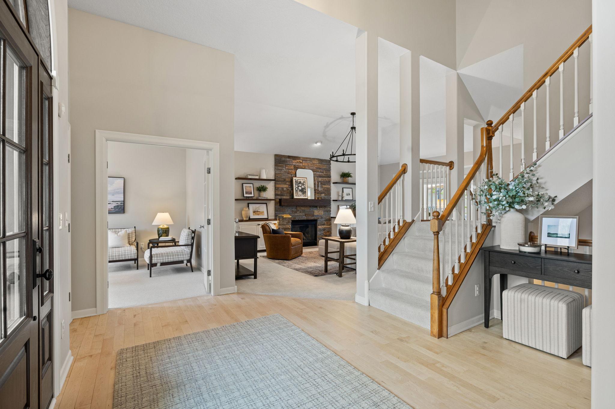 Open foyer to a vaulted living room