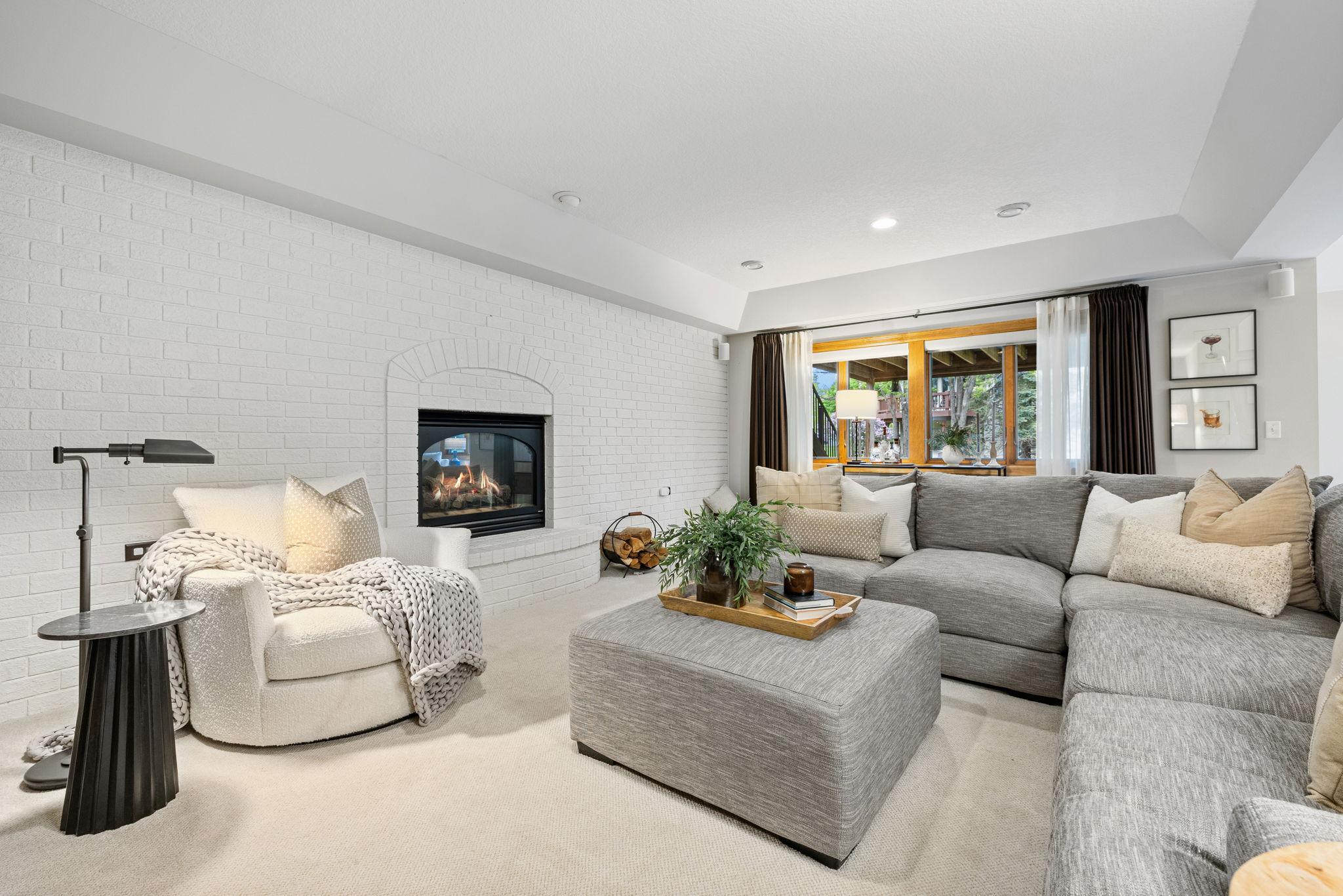 Lower level family room with gas fireplace