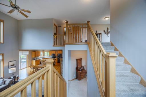Stairs leading to upper level from entryway landing