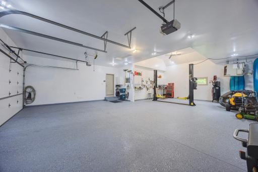 Expansive garage with plenty of room for storage, workshop, and working on cars!