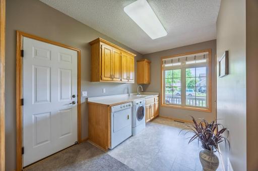 Main level laundry room with tons of storage!