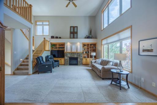 Two Story Bright, Airy Living Room with stone fireplace!