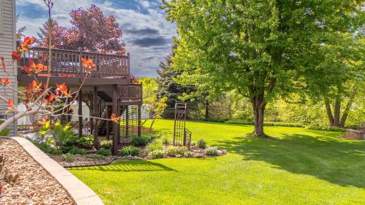 Deck overlooks stunning gardens and yard!