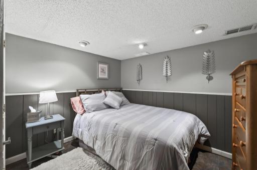 Versatile lower-level flex room â currently used as a media and sitting room. Works well as a hobby space, home gym, playroom, or extra storage. Board-and-batten wainscoting and recessed lighting.
