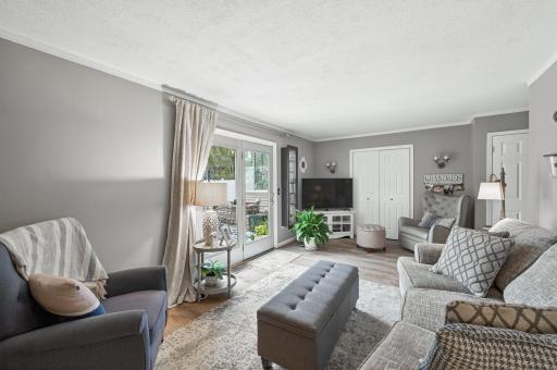 Glass doors open directly from the family room to the patio â summer entertaining flows effortlessly from inside to the pool area.