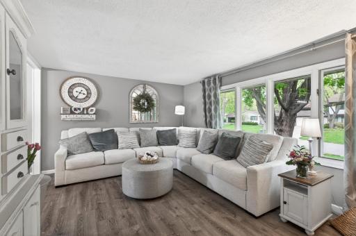 A half level up from the entry, the living room, kitchen, and dining room form one connected entertaining level â open, bright, and easy to move through.