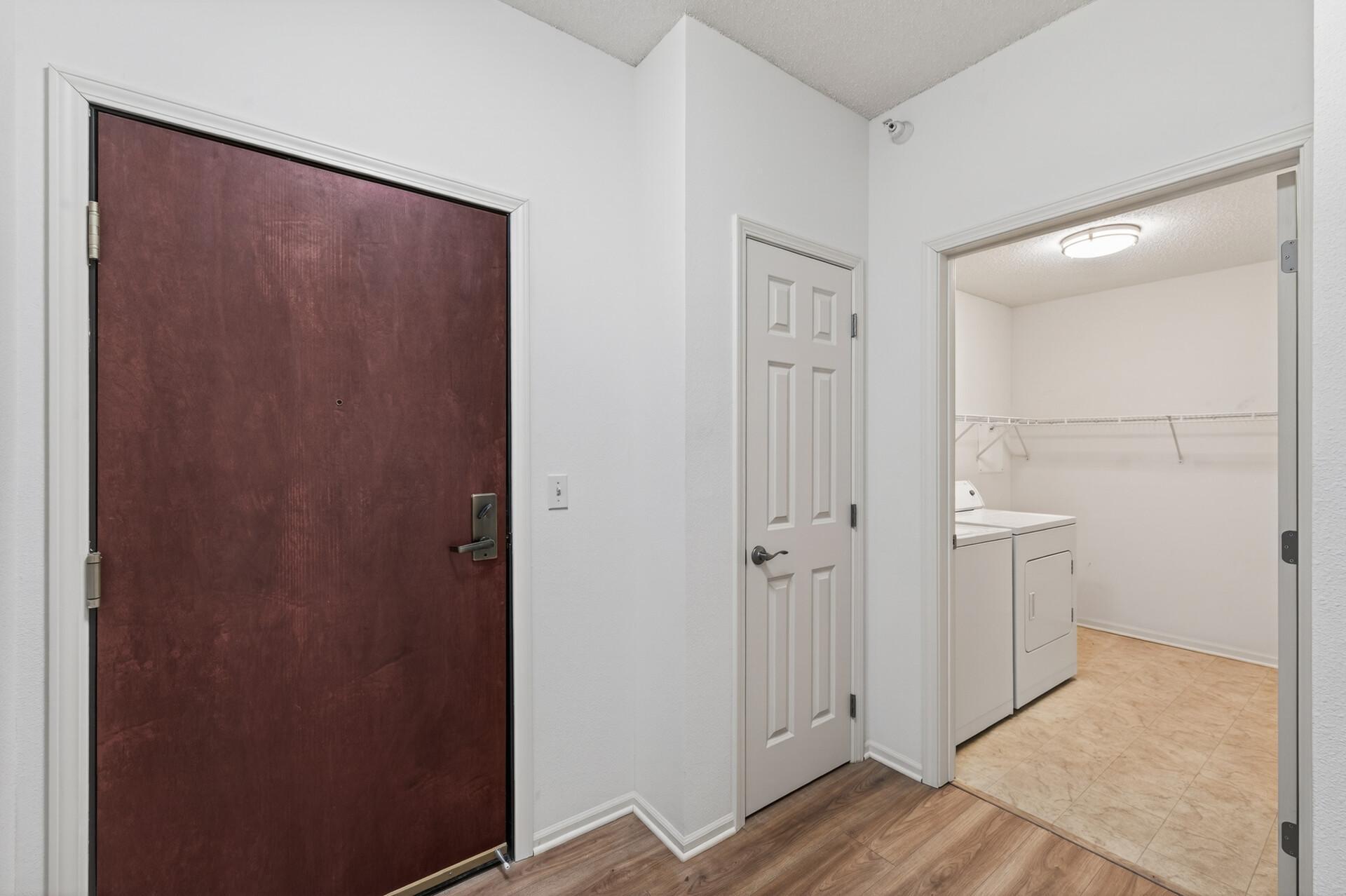 Large entryway with a coat closet and laundry just steps away.