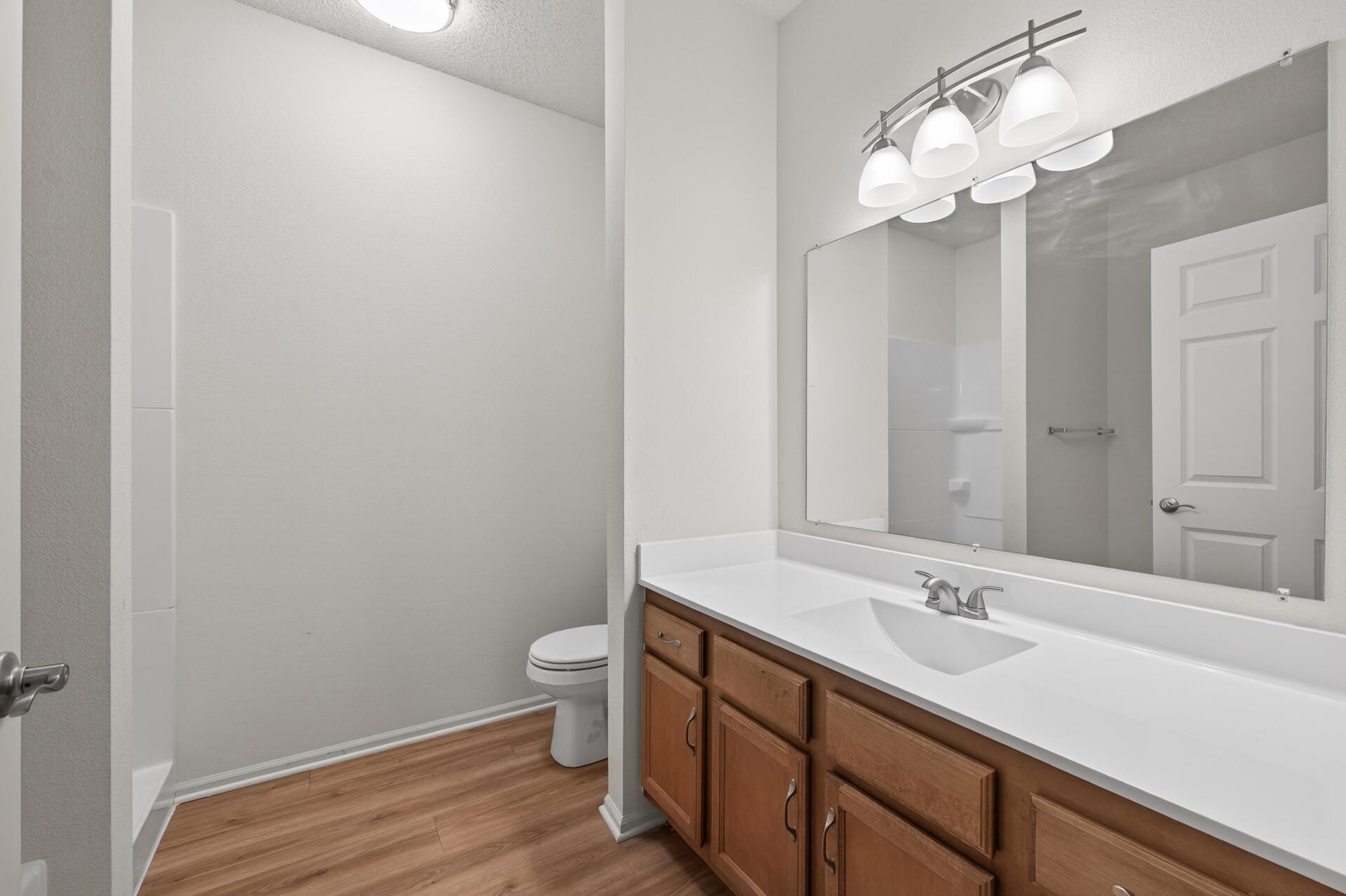 Brand new vanity with plenty of storage and countertop space.
