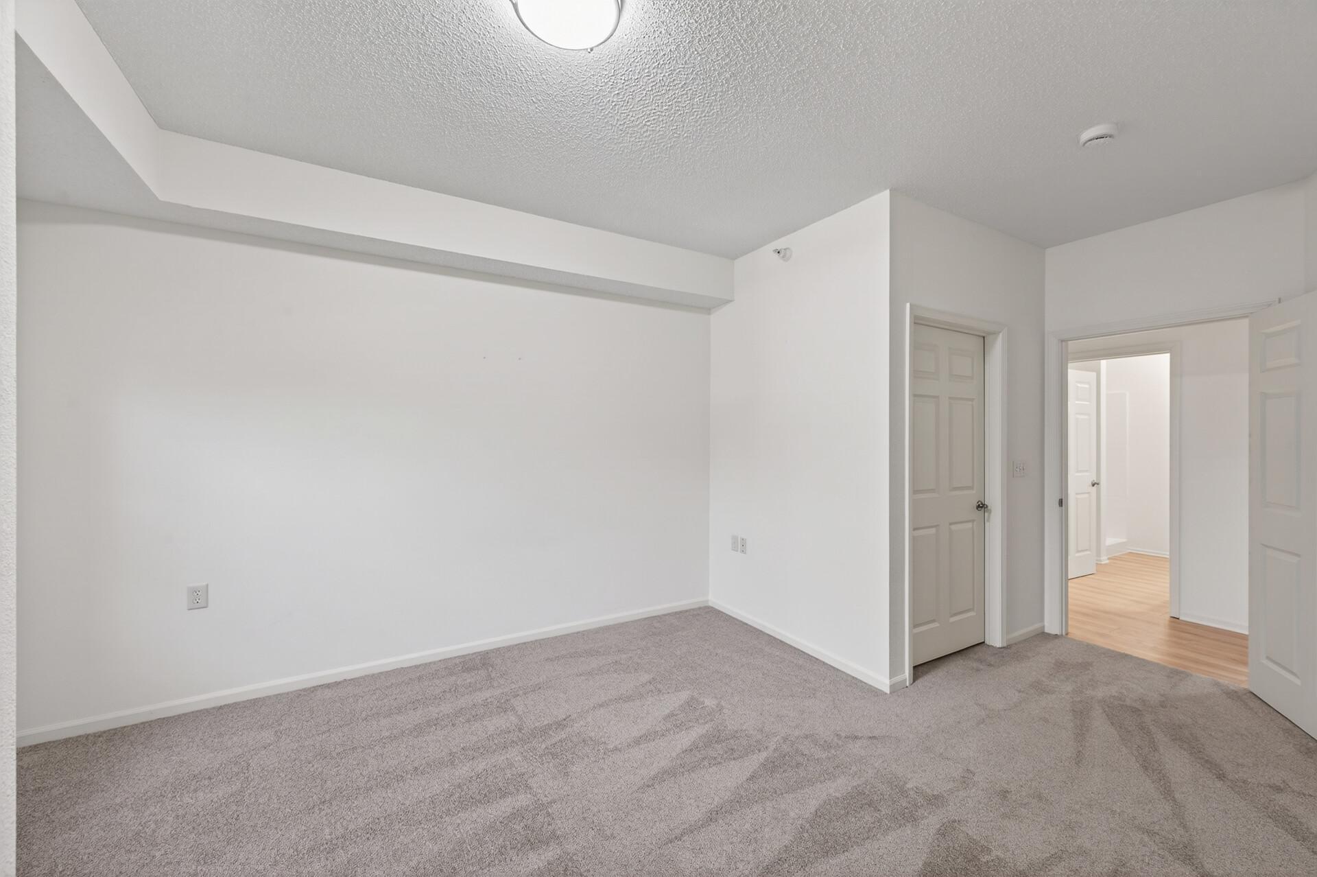 Bedroom without furniture. Plenty of space. Also has a walk-in closet. Steps away from the bathroom.