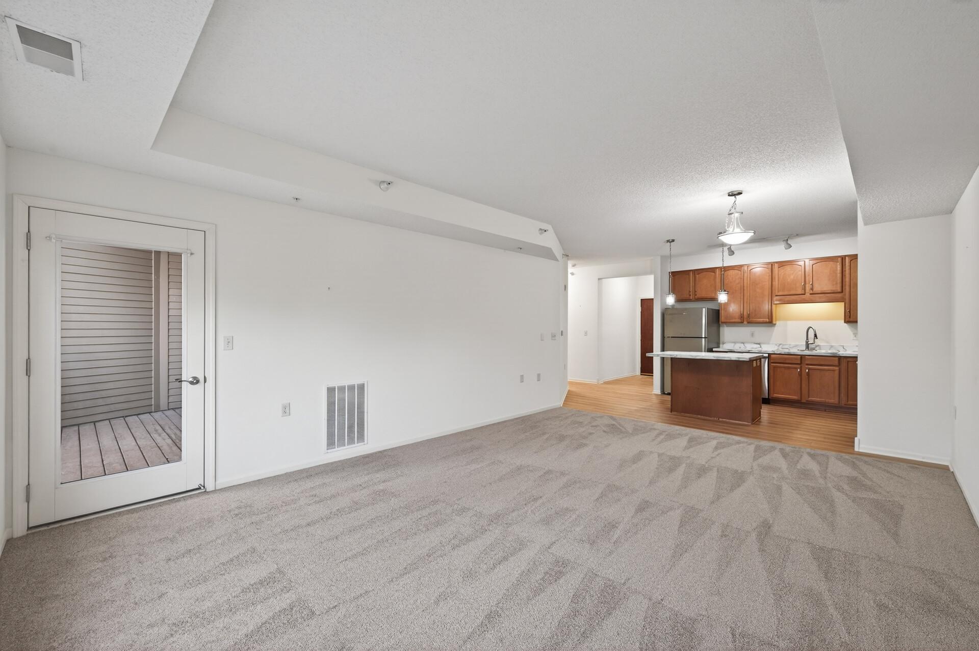 Living room -- connected to a private balcony.
