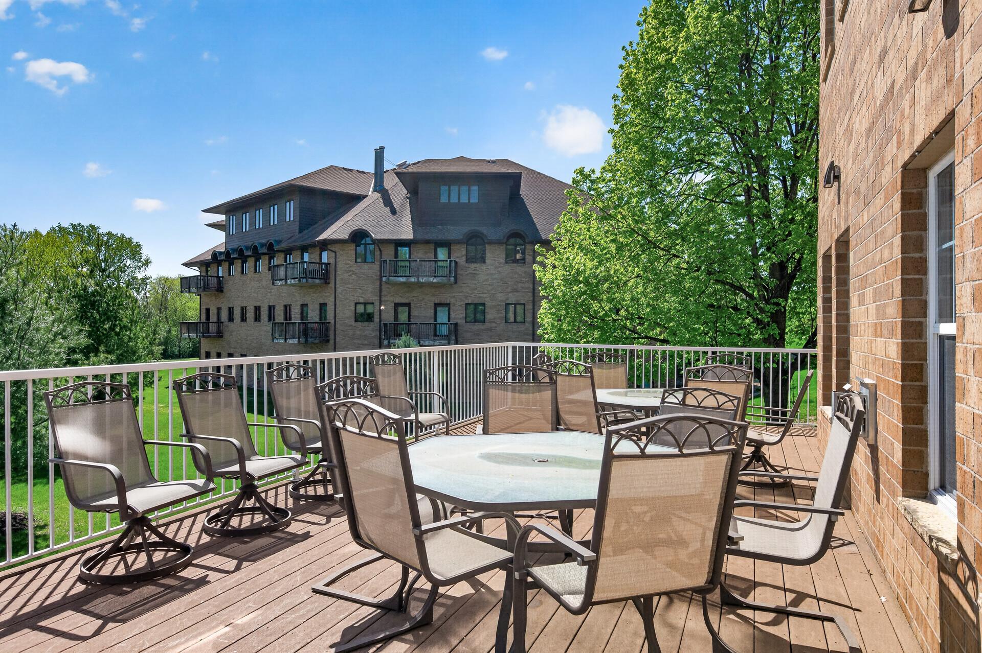 Deck with patio furniture just off of the main floor community room.