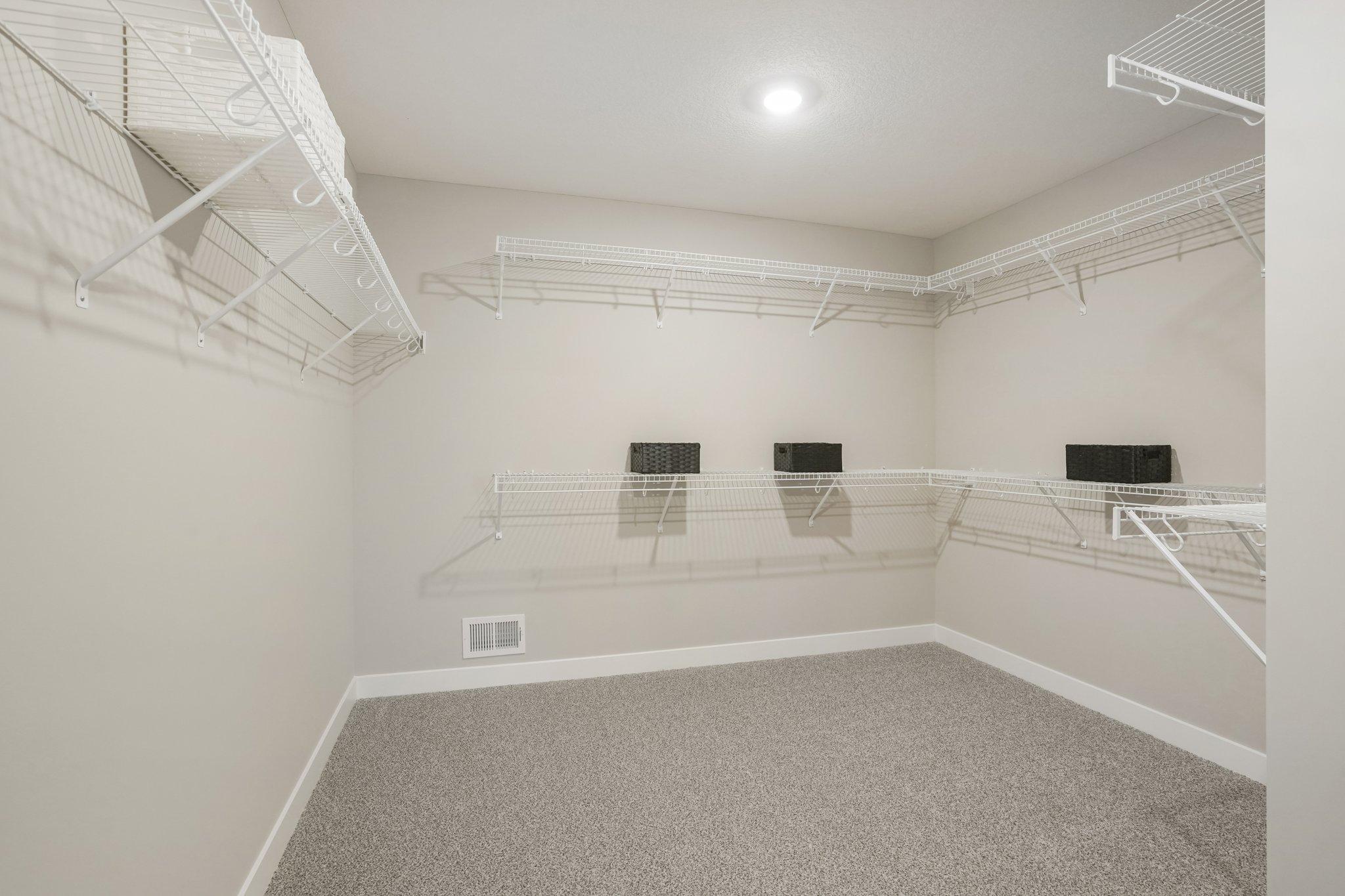 HUGE walk in closet located in the primary bedroom. (Photos of model. Colors and finishes may vary).