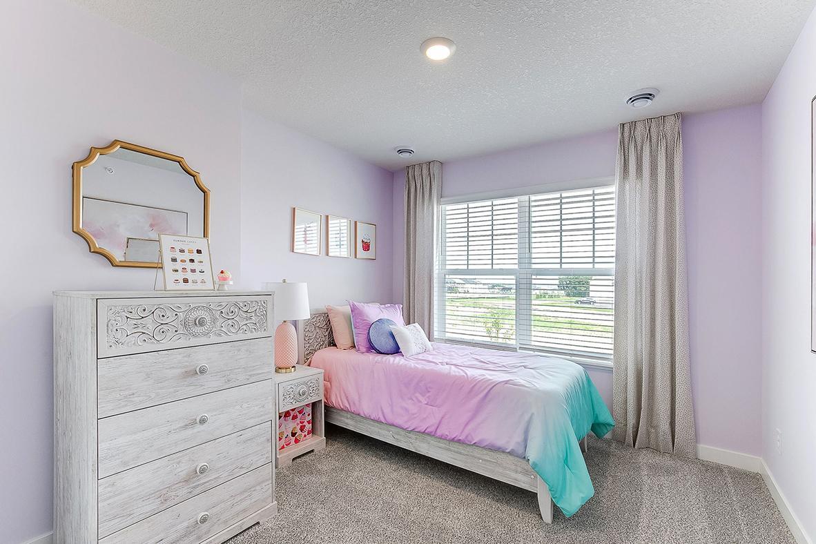 Spacious 3rd bedroom on upper level. Model photos. Options and colors will vary.