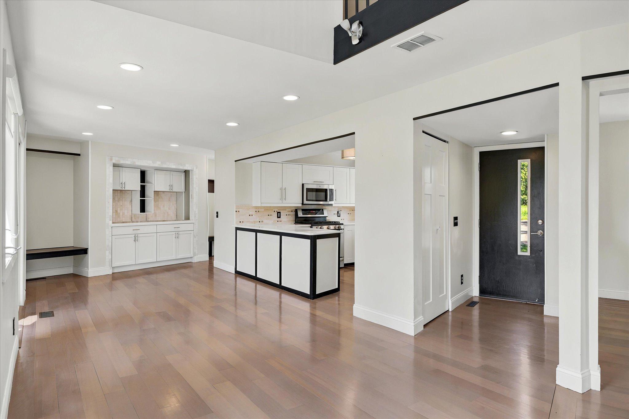 Open dining with buffet built-ins and open to updated kitchen and appliances.