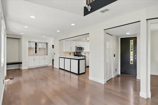 Open dining with buffet built-ins and open to updated kitchen and appliances.
