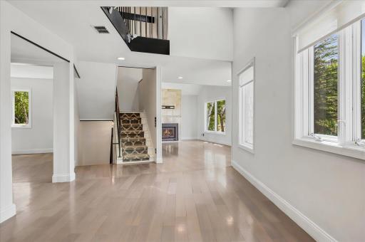 Open concept home with window views from every room and skylight with balcony