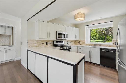 New appliances with gas range and stone countertops